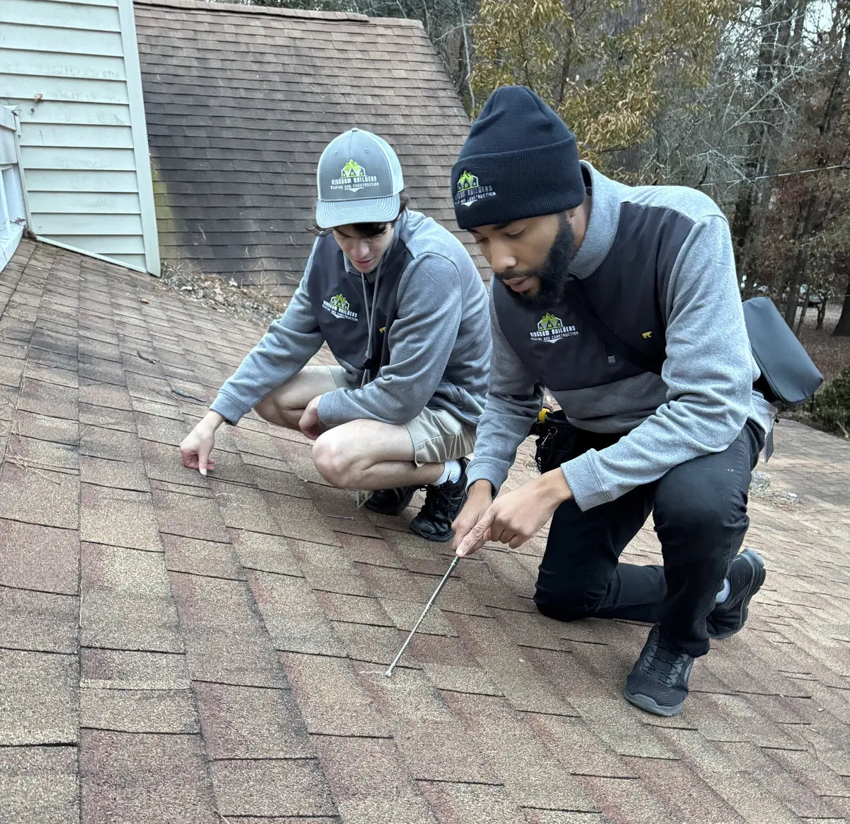 Joshua Hunt providing hands-on roofing training during an inspection